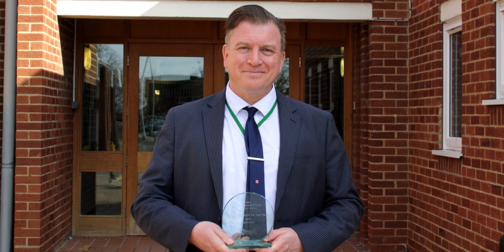Headteacher Simon Porter with the Best Employer of the Year award.